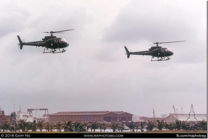 Eurocopter AS350B Écureuils of 123 Squadron performing heli-aerobatics, SAF Display, West Coast Park, July 1983