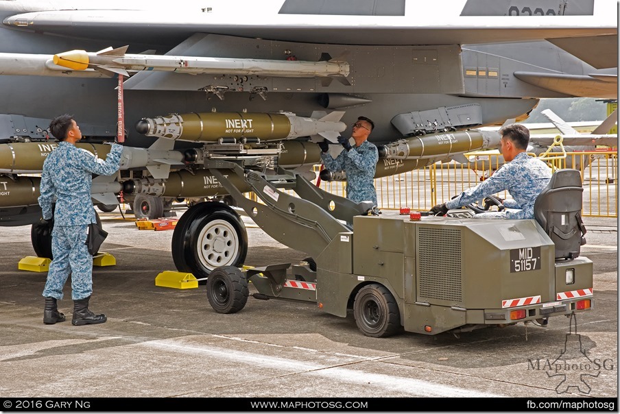 AFEs load a Mk.82 bomb on an F-15SG as part of the Arming Demonstration preview