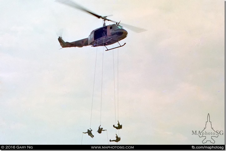 A Bell UH-1H Iroquois in a rapelling display, RSAF 25th Anniversary, Paya Lebar Airbase, September 1993