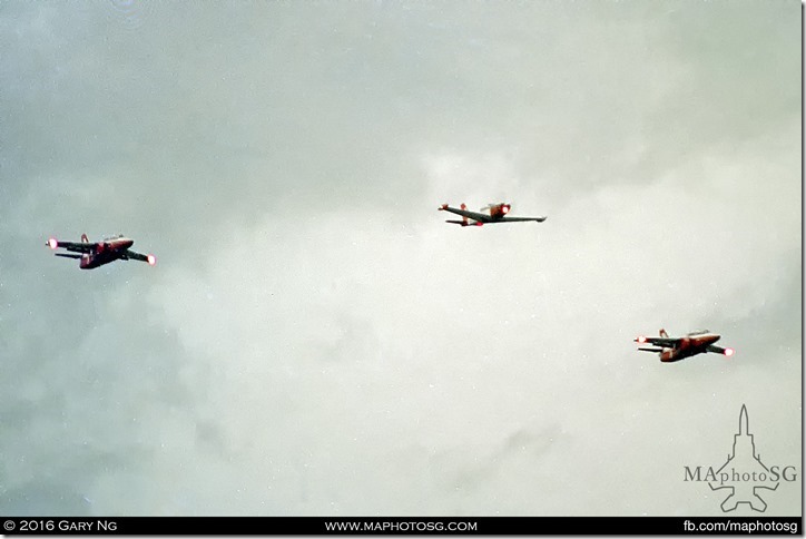 A SIAI-Marchetti SF.260M and two SIAI-Marchetti S.211s fly in formation, SAF Military Tattoo, National Stadium, June 1990
