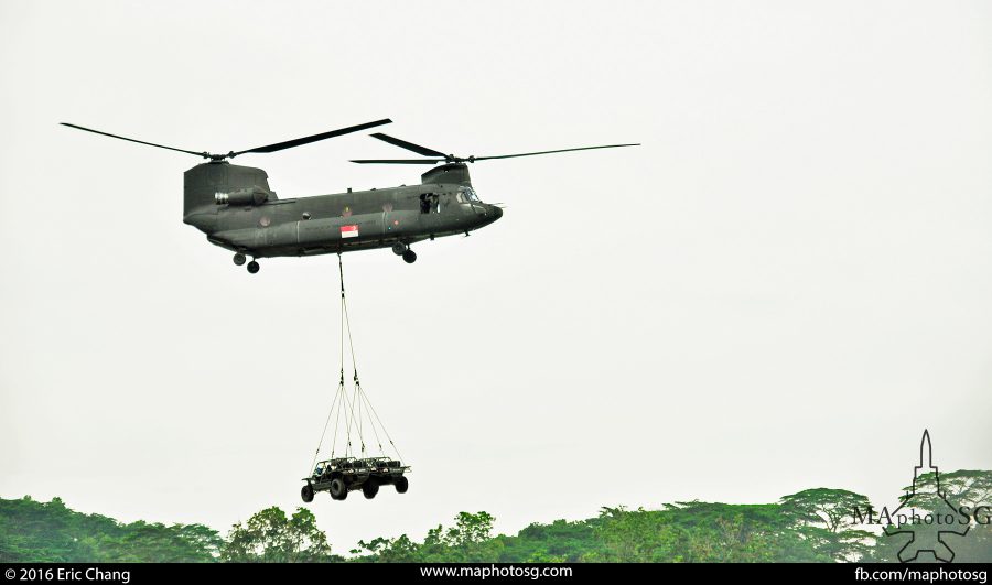 RSAF's CH-47SD Chinook heavylift helicopter transporting Army Light Strike Vehicles