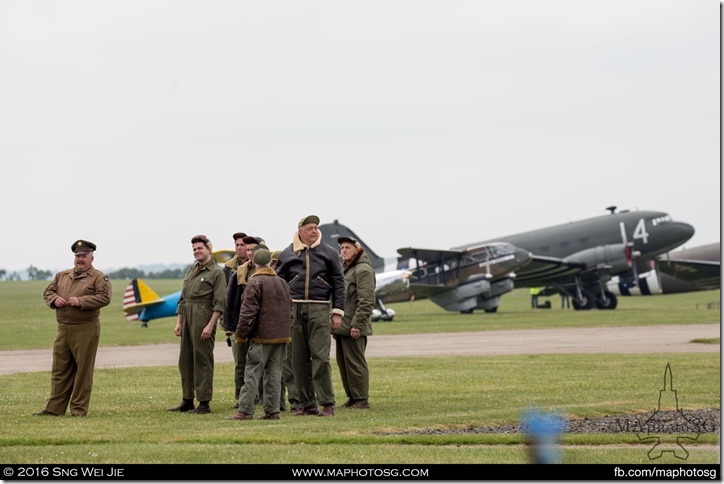 Period accurate ground crewmen watching the aerial display