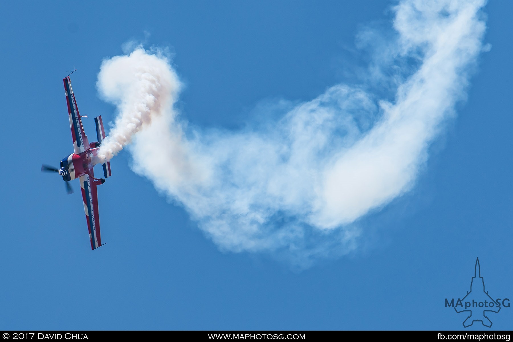 33. French Ministry of Defence Extra 330 aircraft performs a series of rolls in one of  the daily flying displays of the show.