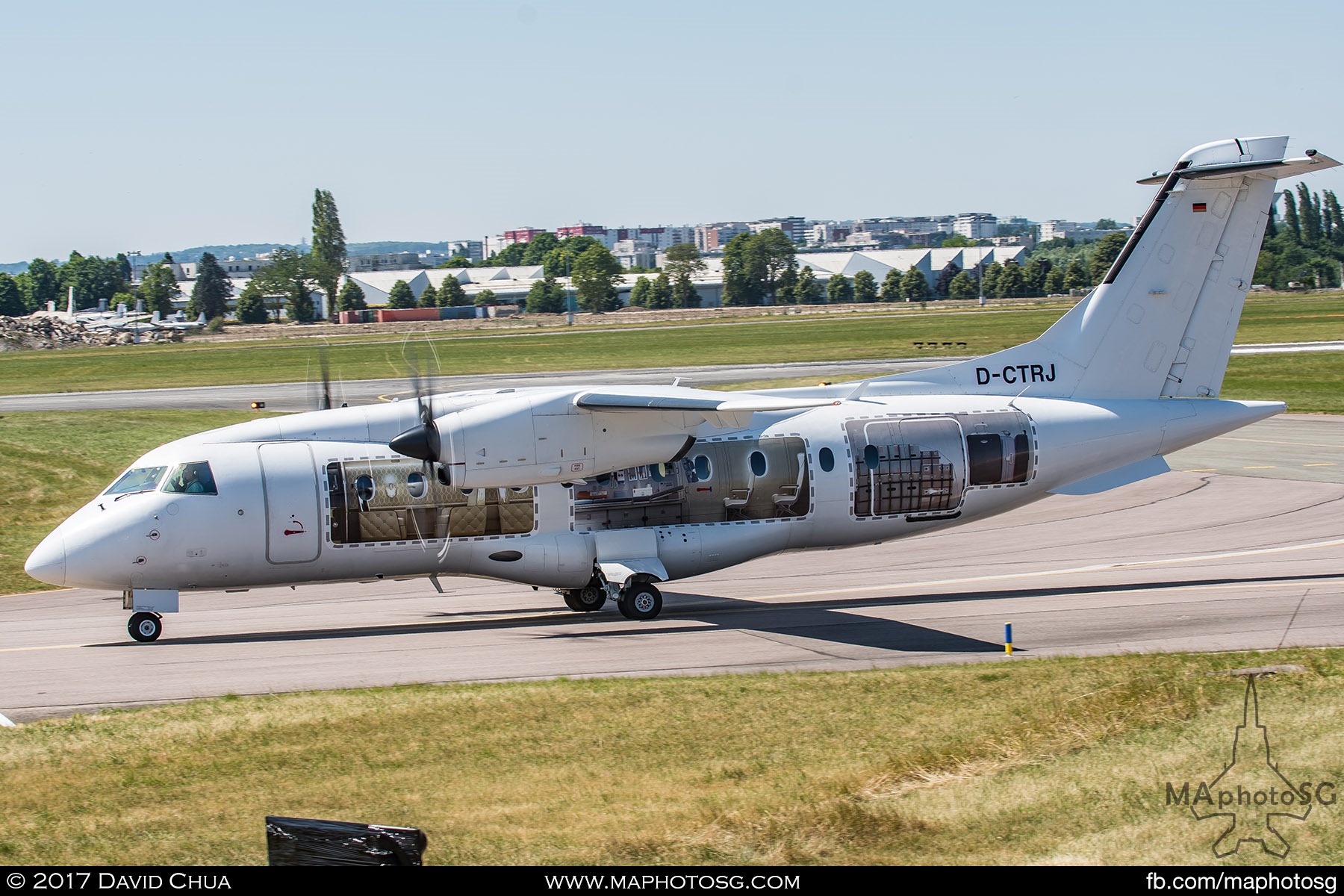 31. Dornier 328 taxis to prepare for it’s demonstration segment. This particular aircraft has a cut away fuselage livery of the different configurations available for the aircraft.