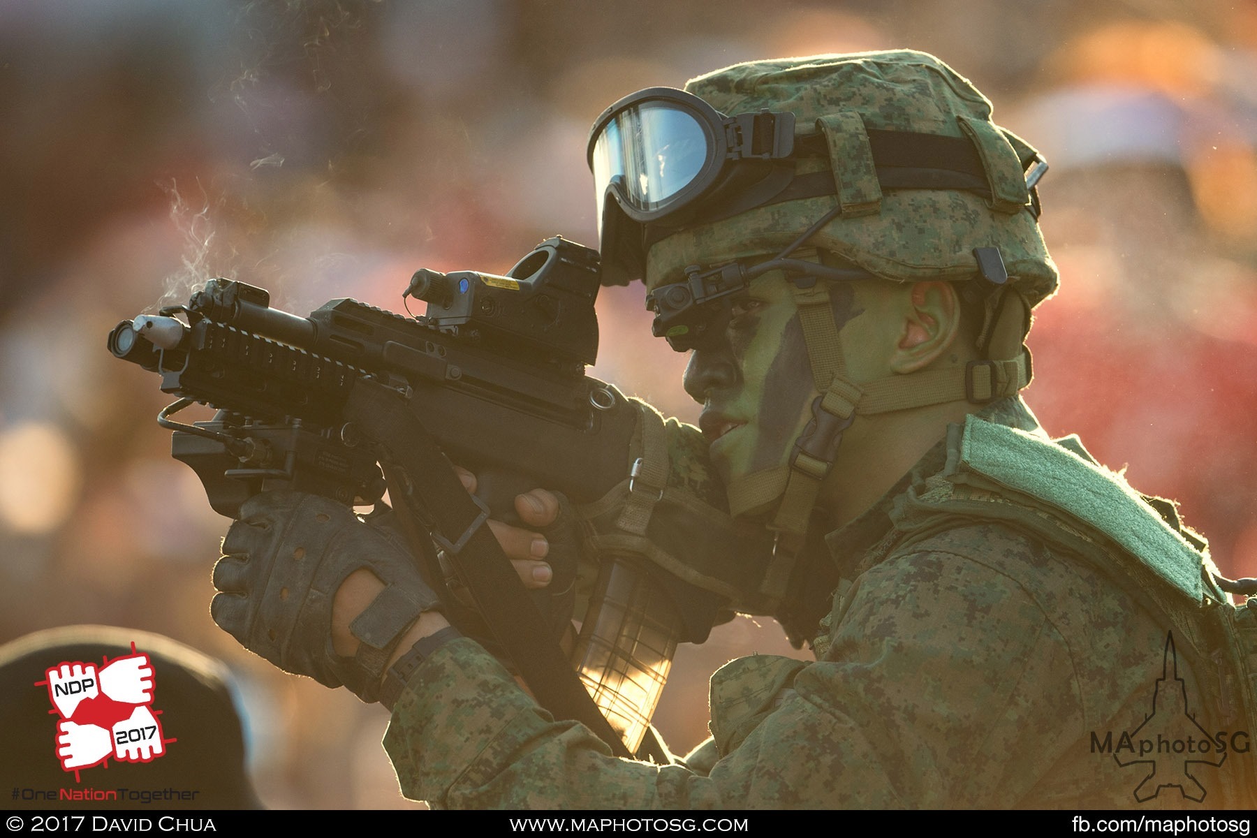 16. Infantryman from the Singapore Armed Forces in action within the spectator stands.