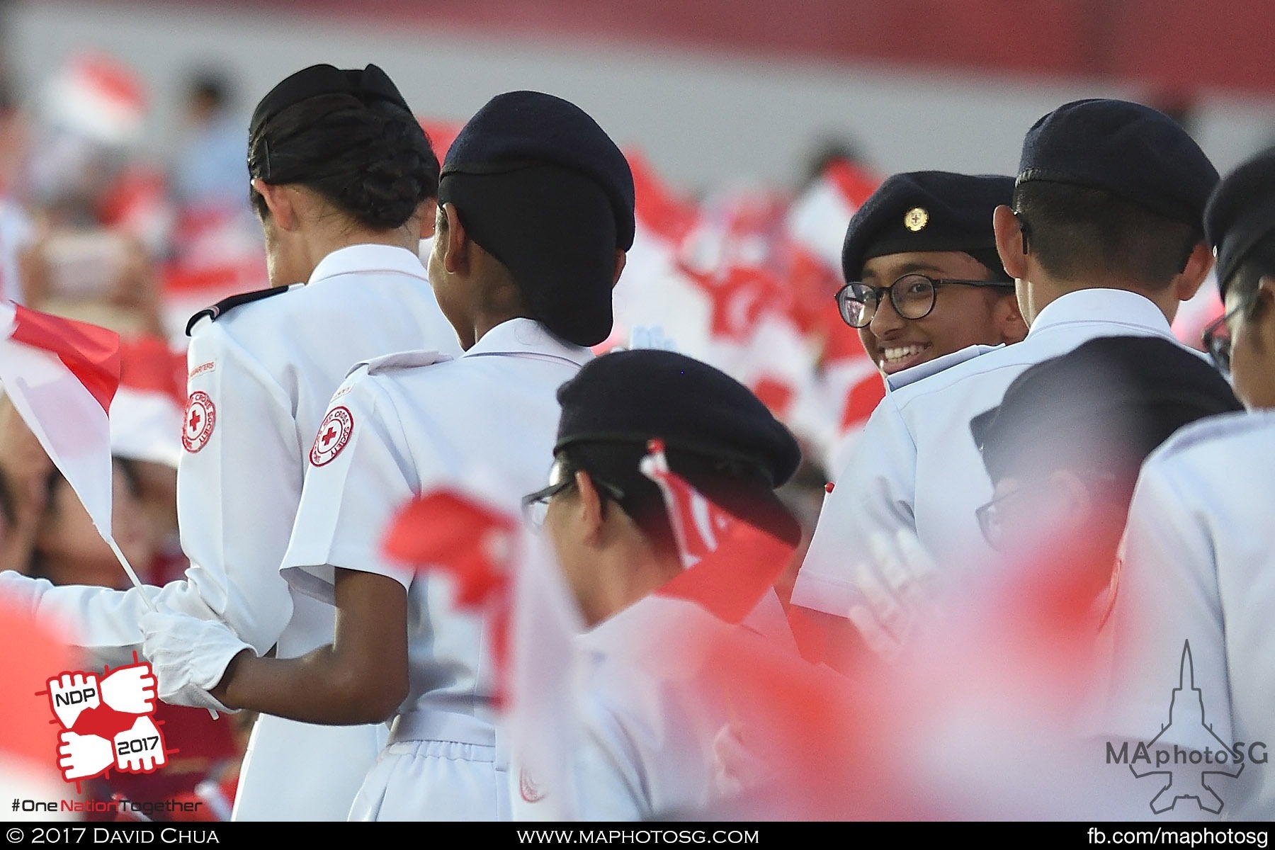 33. Red Cross contingent members march up the spectator stands.