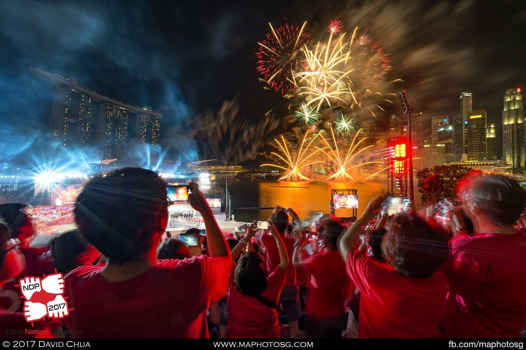 40. Grand Finale as spectators sing to a medley of NDP songs while fireworks goes off in the Marina Bay.