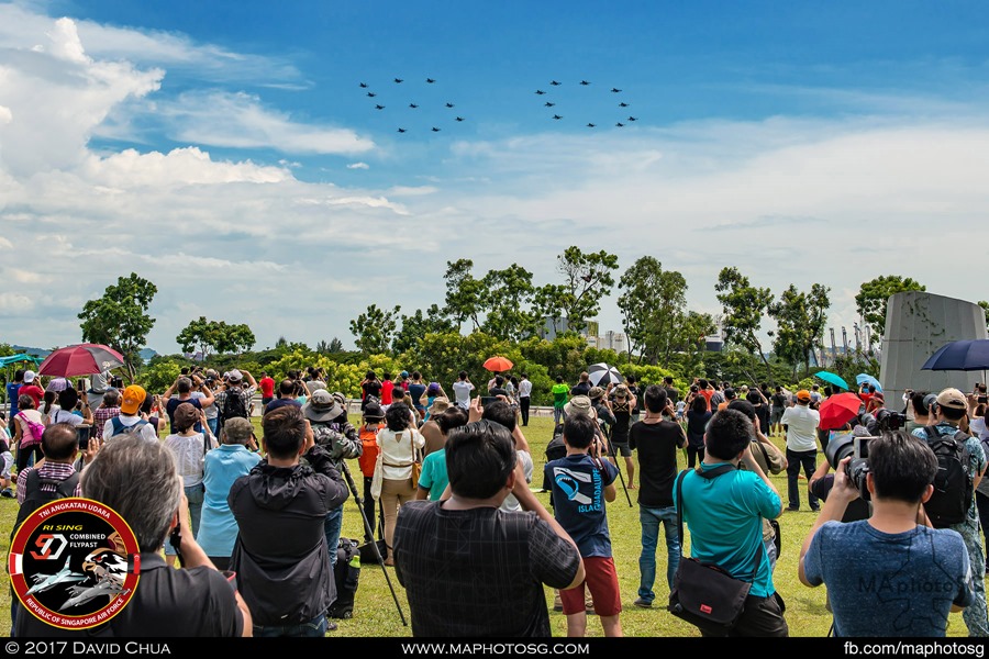 Crowd gathered at Marina Barrage as the "50" Formation flies overhead