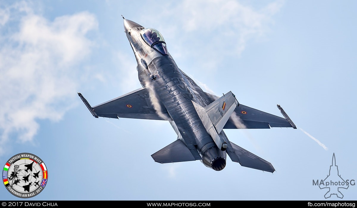 35. Belgian Air Force F-16A MLU (FA-133) glints of the sun as it pulls up after a low pass.