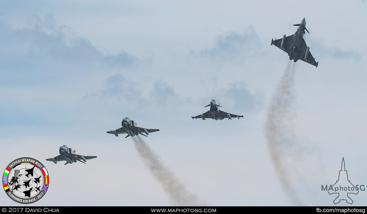 42. 4 ship formation of 2 Eurofighter Typhoons and 2 F-4E Phantom IIs breaks as it flies pass the airfield.