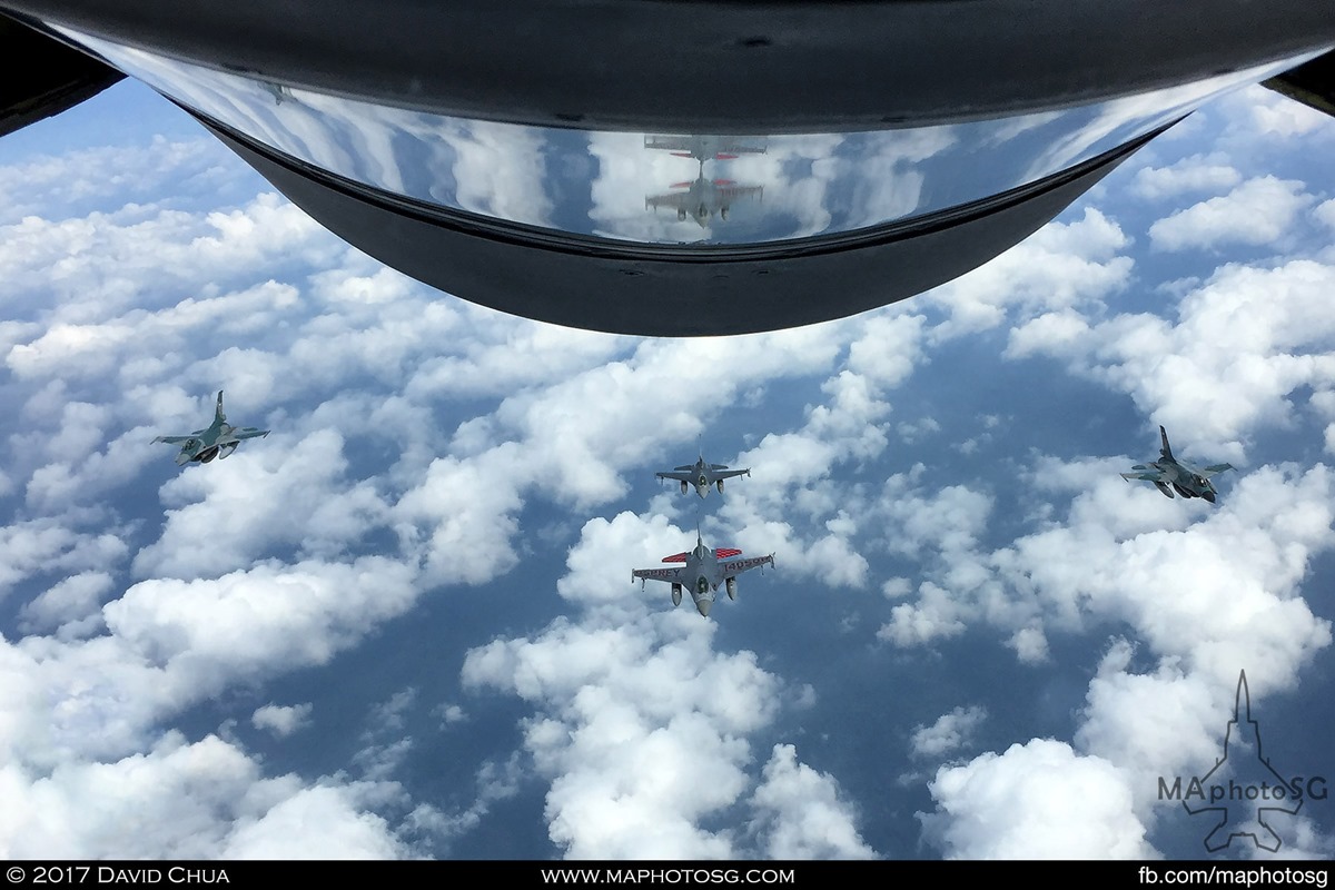 Two RSAF F-16s (center) and two TNI-AU F-16s (left, right) conducting work-up training for the RISING50 combined flypast within Singapore and Indonesia’s airspace