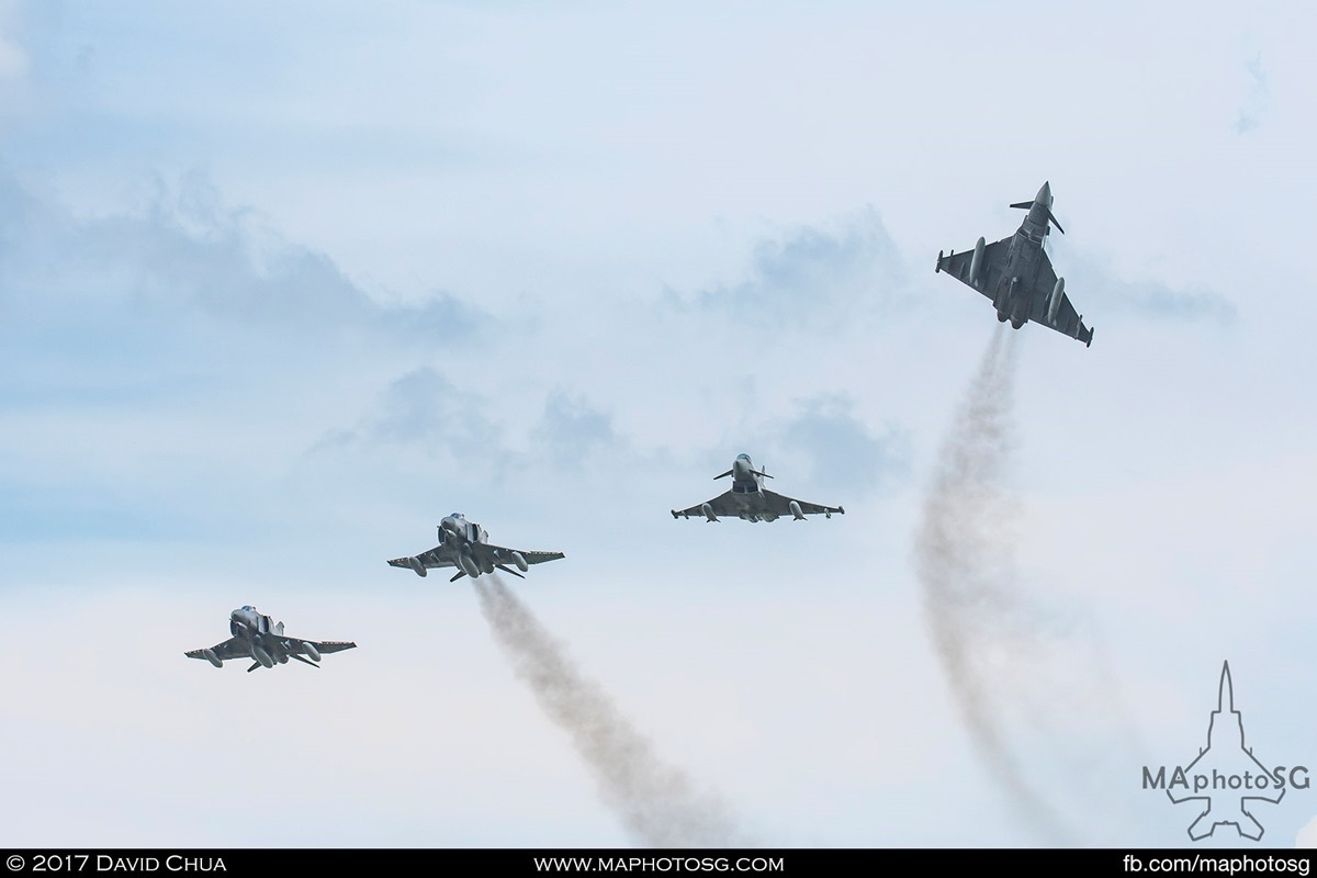 The old and the new, a formation of 2 Phantoms and 2 Eurofighters flies overhead as one of the Eurofighters breaks