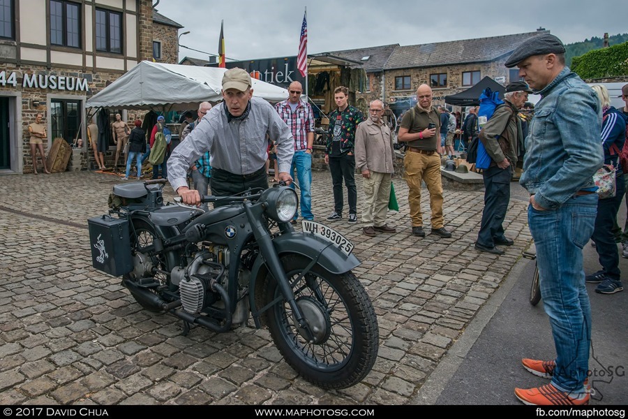 Visitors watch as the owner of this vintage BMW R71 starts it up