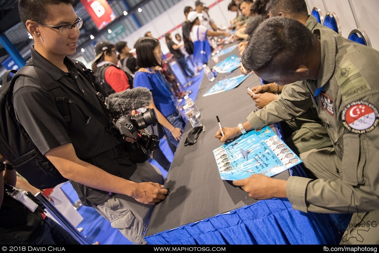 Fans getting autographs from the pilots and crew of the RSAF Aerial Display Team