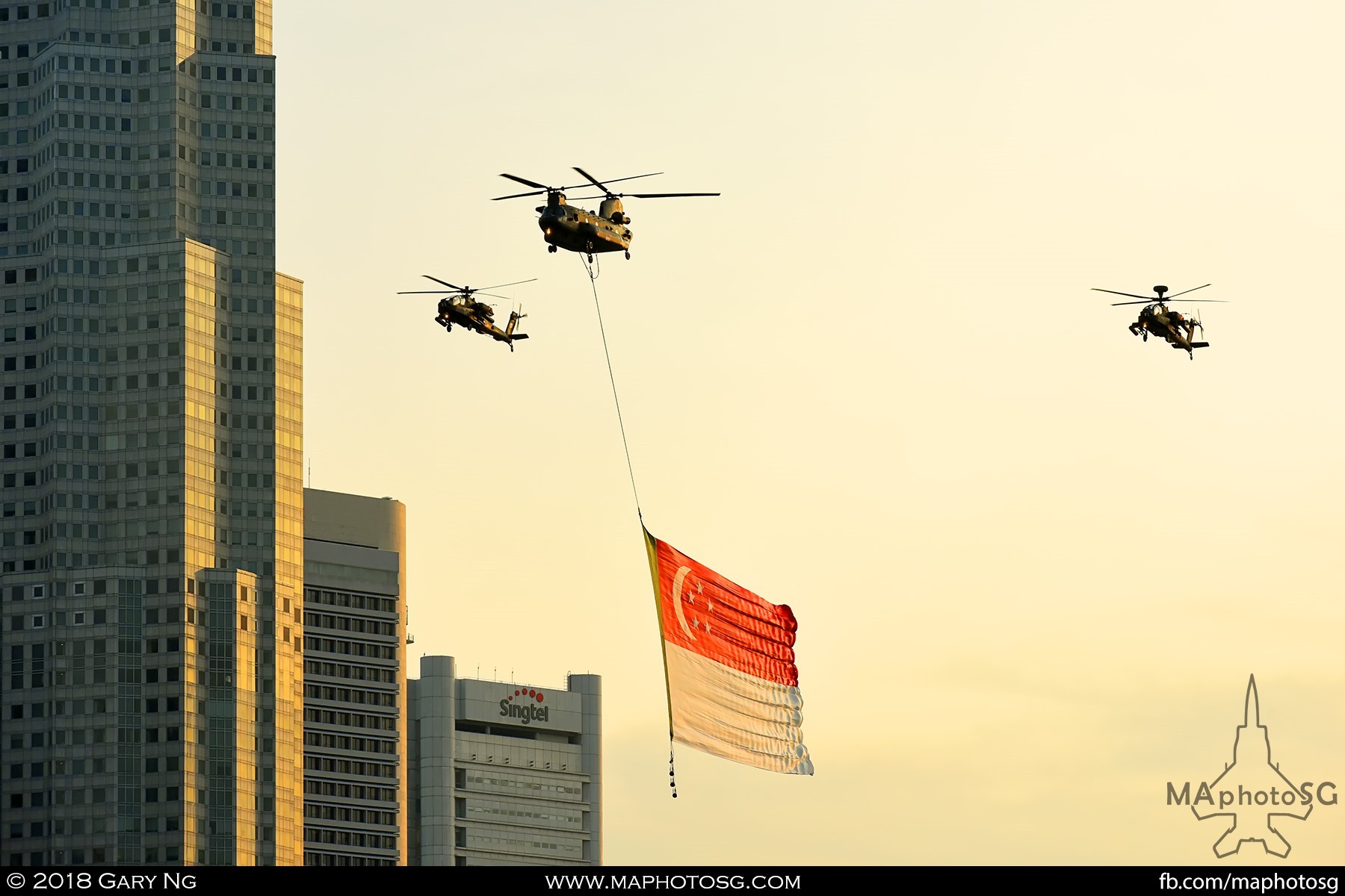 1850 – A CH47D Chinook escorted by two AH-64 Apaches performs the State Flag Fly Past