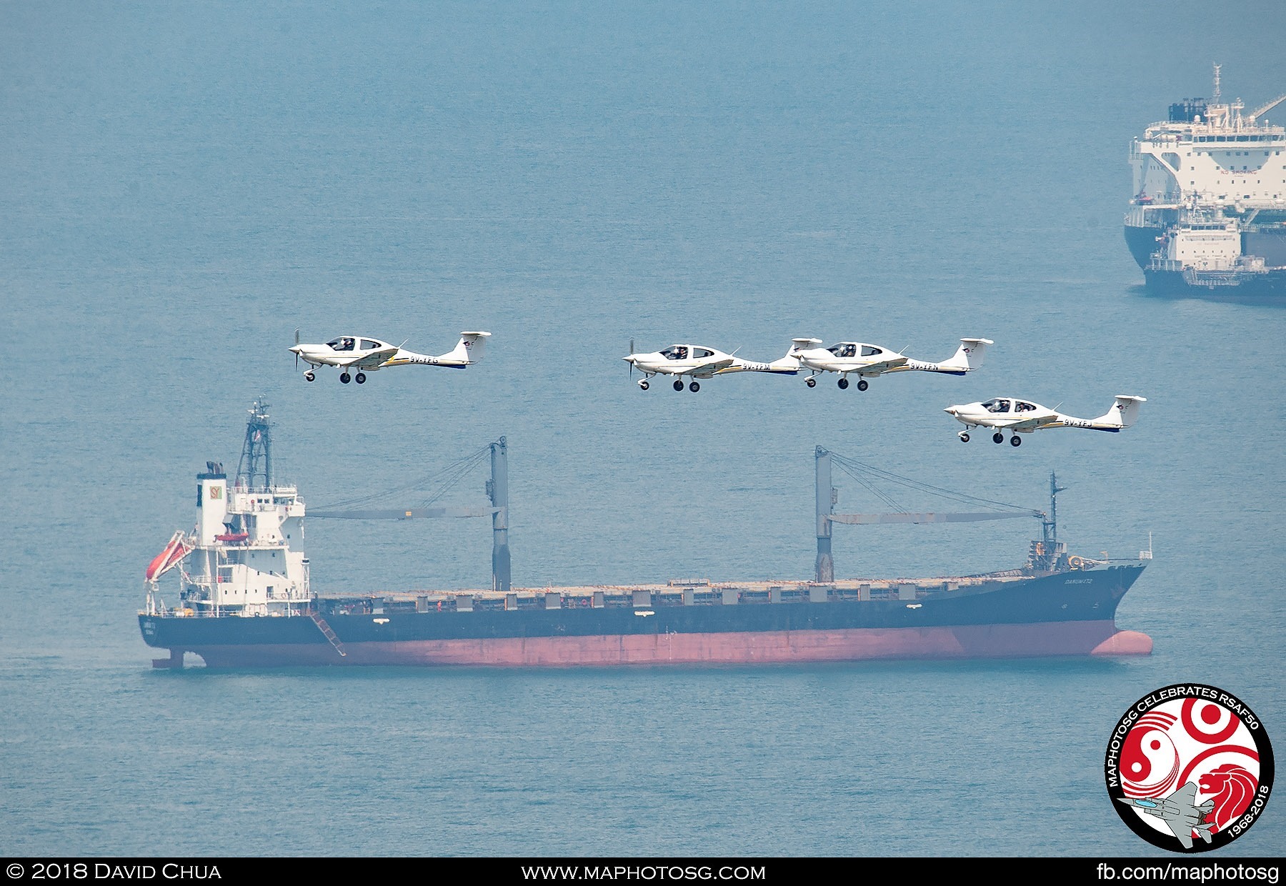 Starting off the fly past segment, four DA40s from the Singapore Youth Flying Club, flies over the Marina Barrage in a Diamond formation.