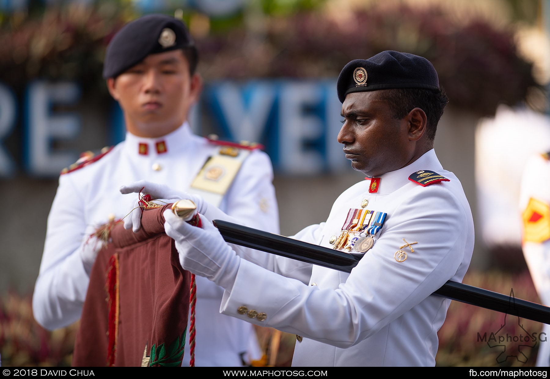 10. Guard of Honour Colours RSM uncasing one of the many SAF Regimental Colours at the Singapore Flyer.