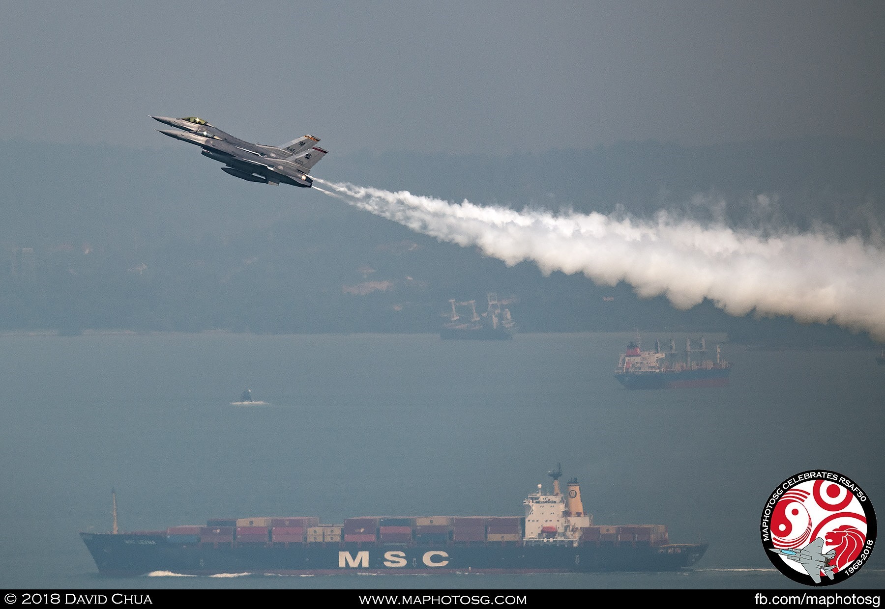 Low and Slow – The two F-16Cs fly in close formation at a hgh angle of attack and low airspeed, looking poised and ready to strike.