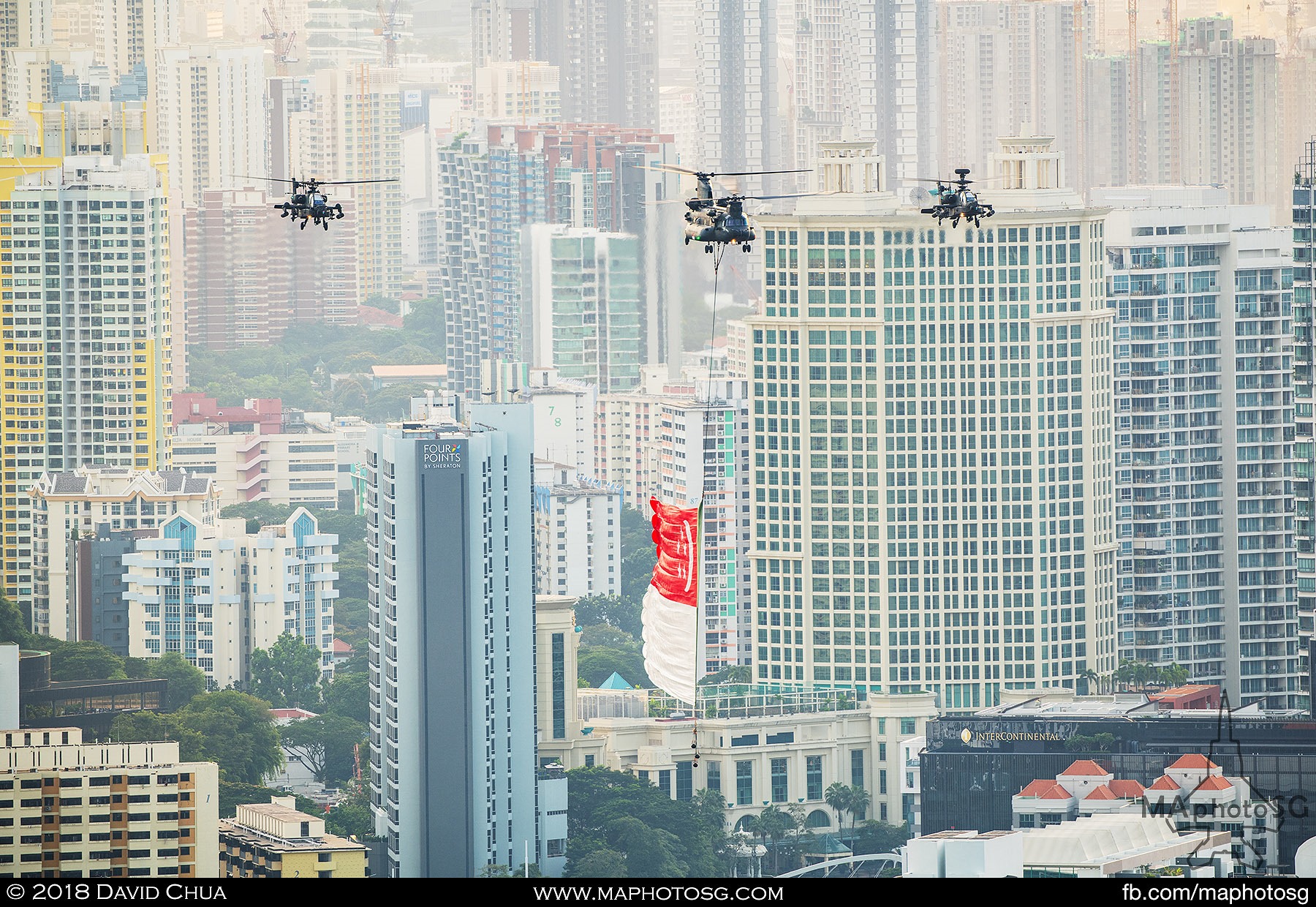 16. State flag fly past helicopters consisting of one RSAF CH-47D Chinook and two AH-6D Longbow Apaches enroute to the Floating Platform.