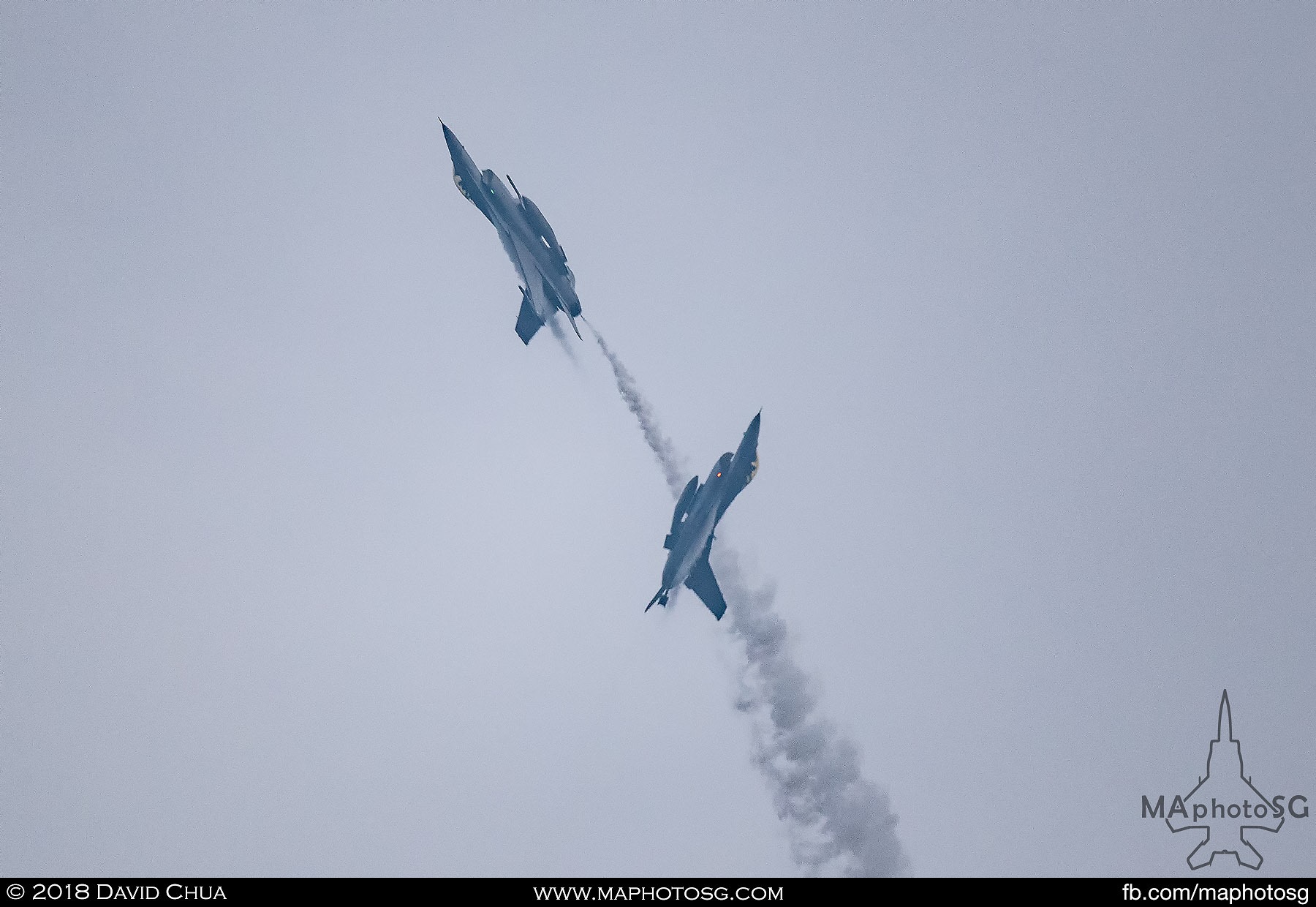 30. Two RSAF F-16C Vipers draws a heart in the sky with white smoke.