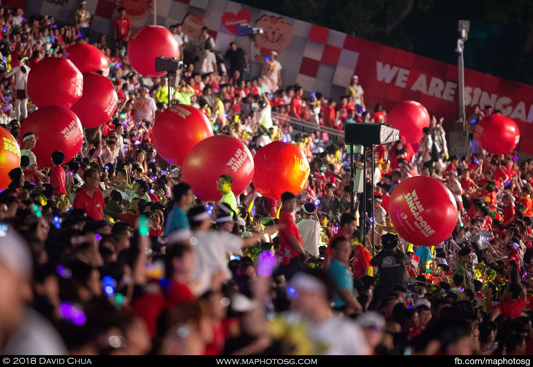 38. Giant balls being passed down from the top of the spectator stands.