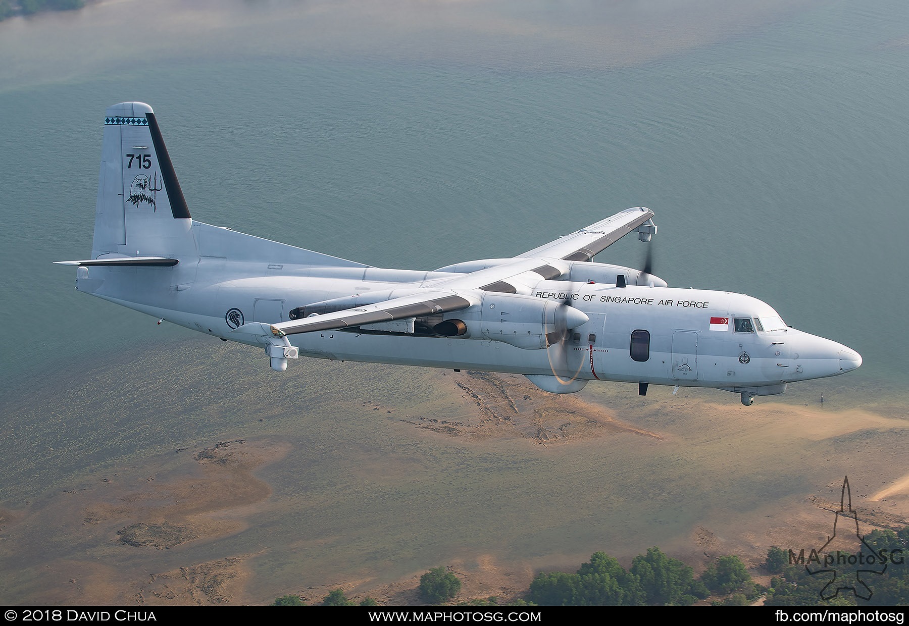 Fokker 50 MPA on the left side of the C-130H Hercules as it enters show center