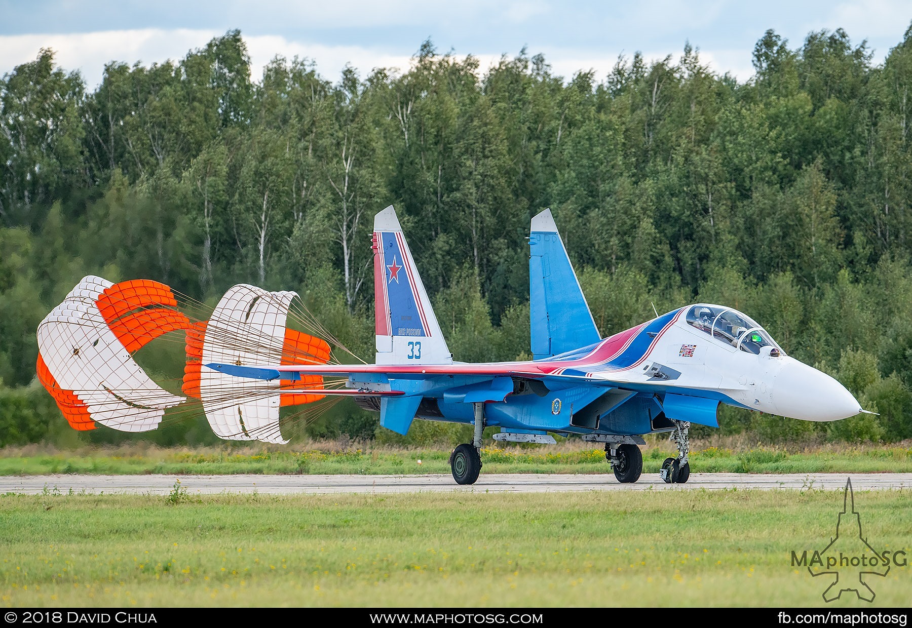 49. A Russian Knights Su-27sm "Flanker" lands on the runway as they complete their aerial display performance.