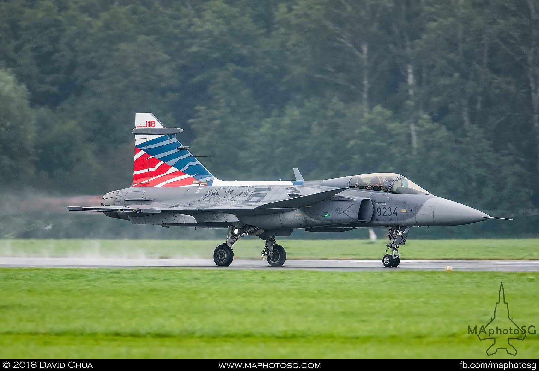 31. Czech Air Force Jas-39C Gripen thunders down the wet runway in front of the crowd