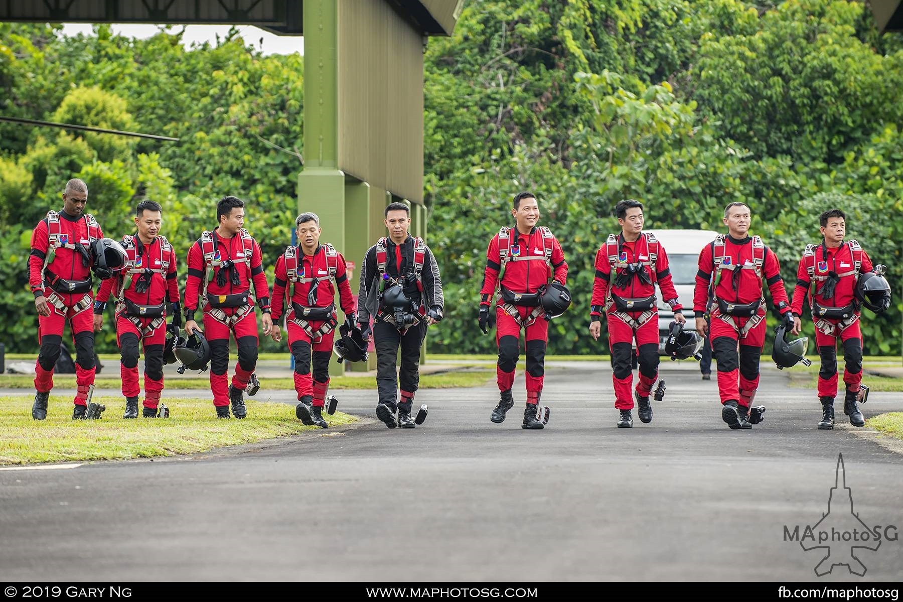 Singapore Armed Forces Red Lions Parachute team prepares to board their ride to show centre