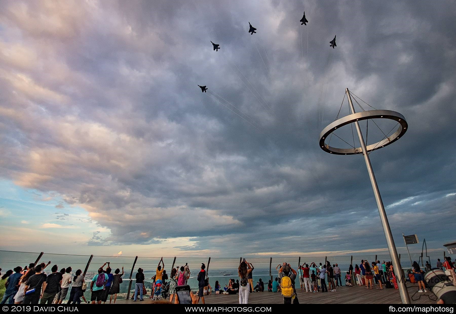 Crowd on Marina Bay Sands Observation Deck entertained by the bomb burst of 5 RSAF F-15SGs