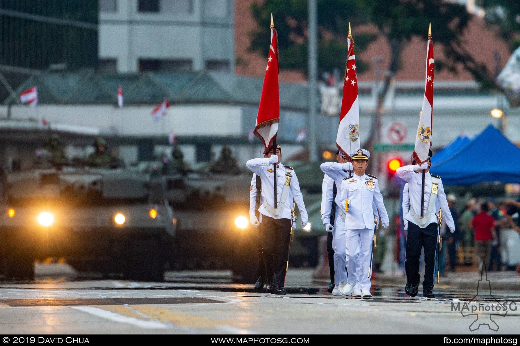 Parade Commander LTC Alvin Choo with the State Colours as Leopard 2SG tanks waits in the background