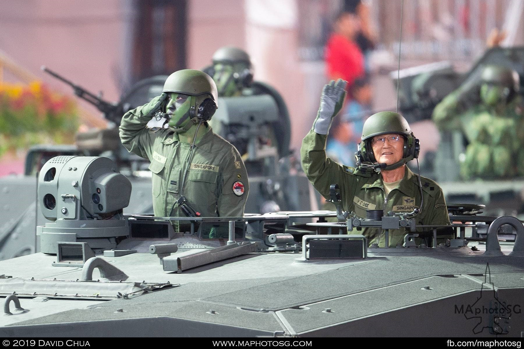 Merdeka Generation serviceman LTC (RET) Chee Hoong Chee waves to the crowd