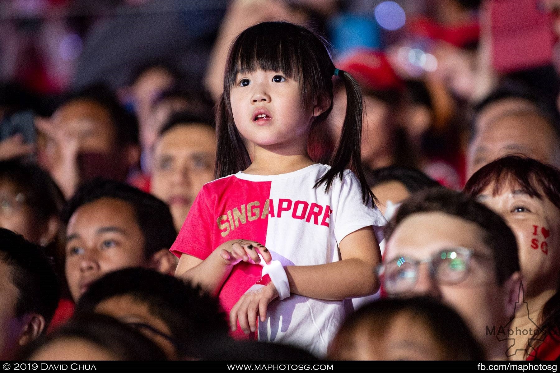 A young girl stood fascinated by the show
