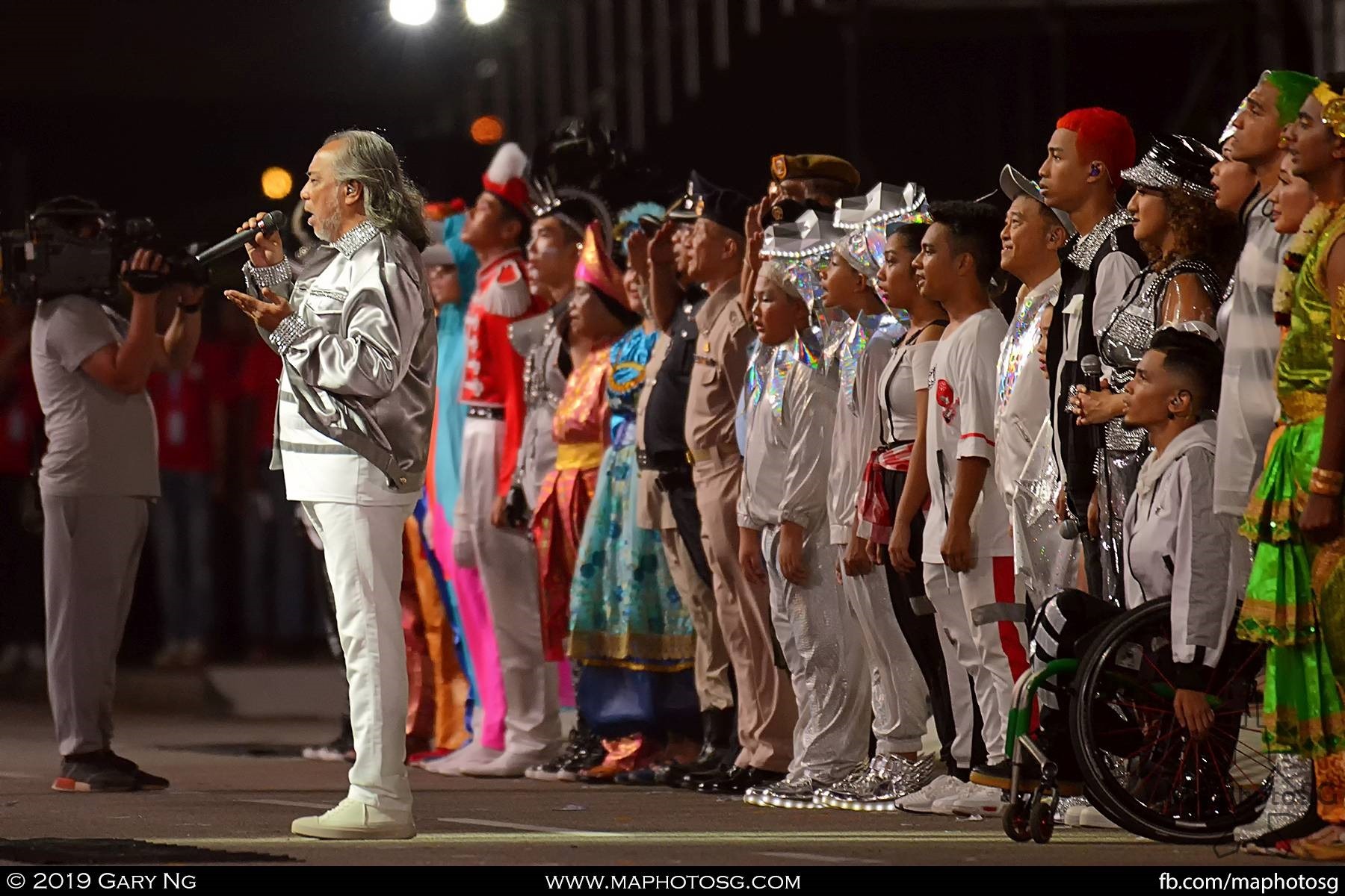 Singapore rock legend Ramli Sarip leads the National Anthem as the celebrations draws to a close