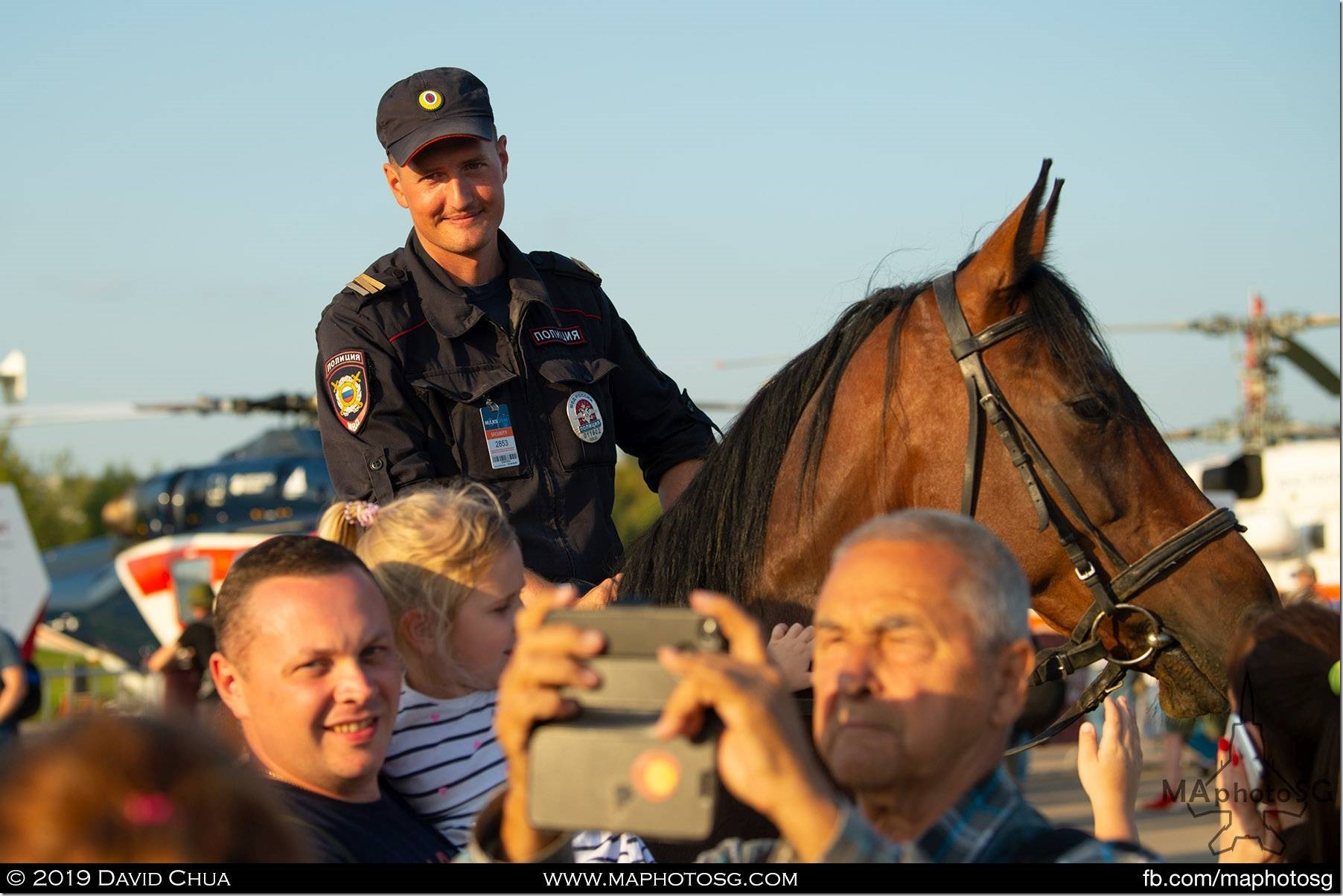 One of the many security officers on horseback mingling with the crowd