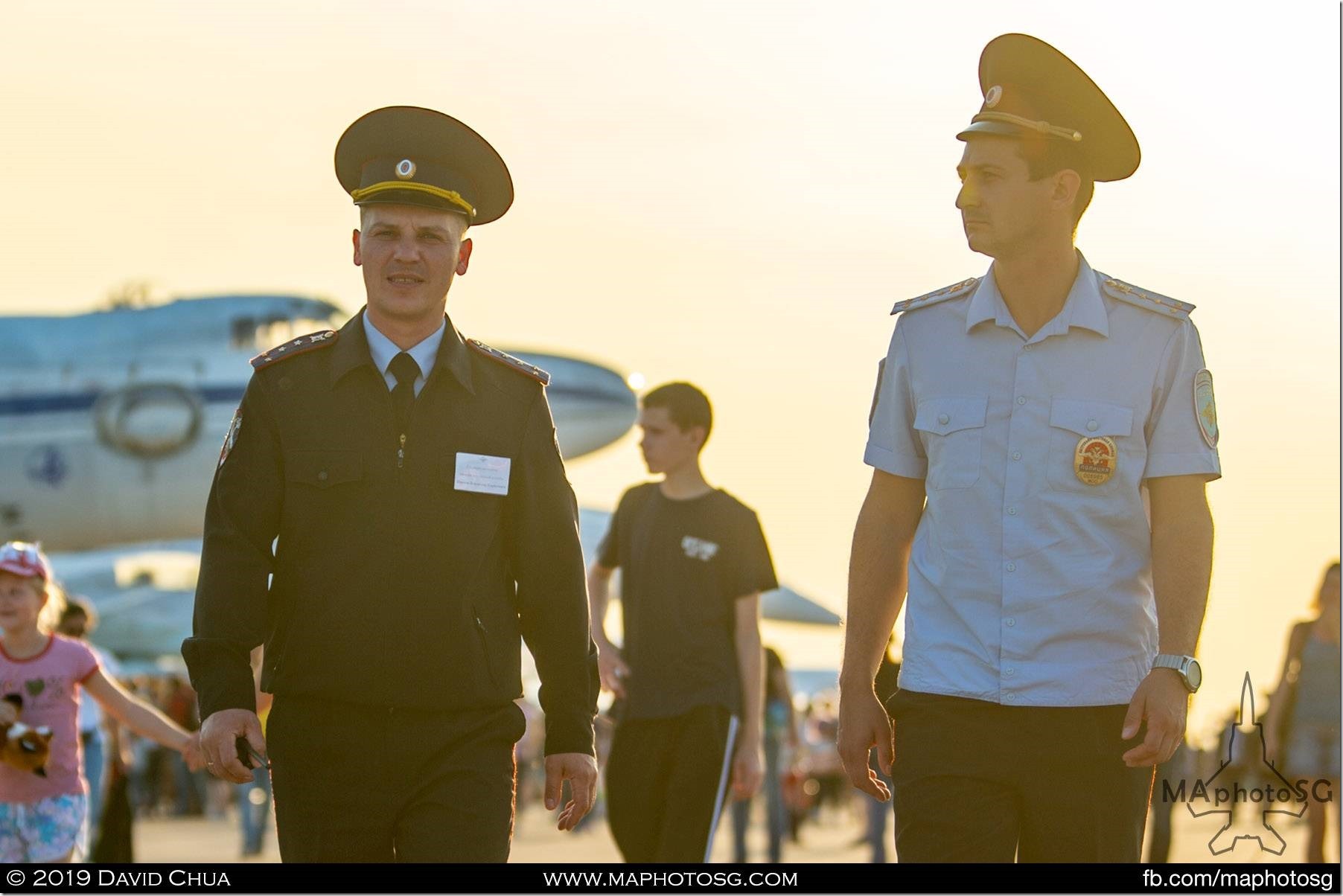 Two members of the Russian Air Force taking a walk around the static aircraft displays