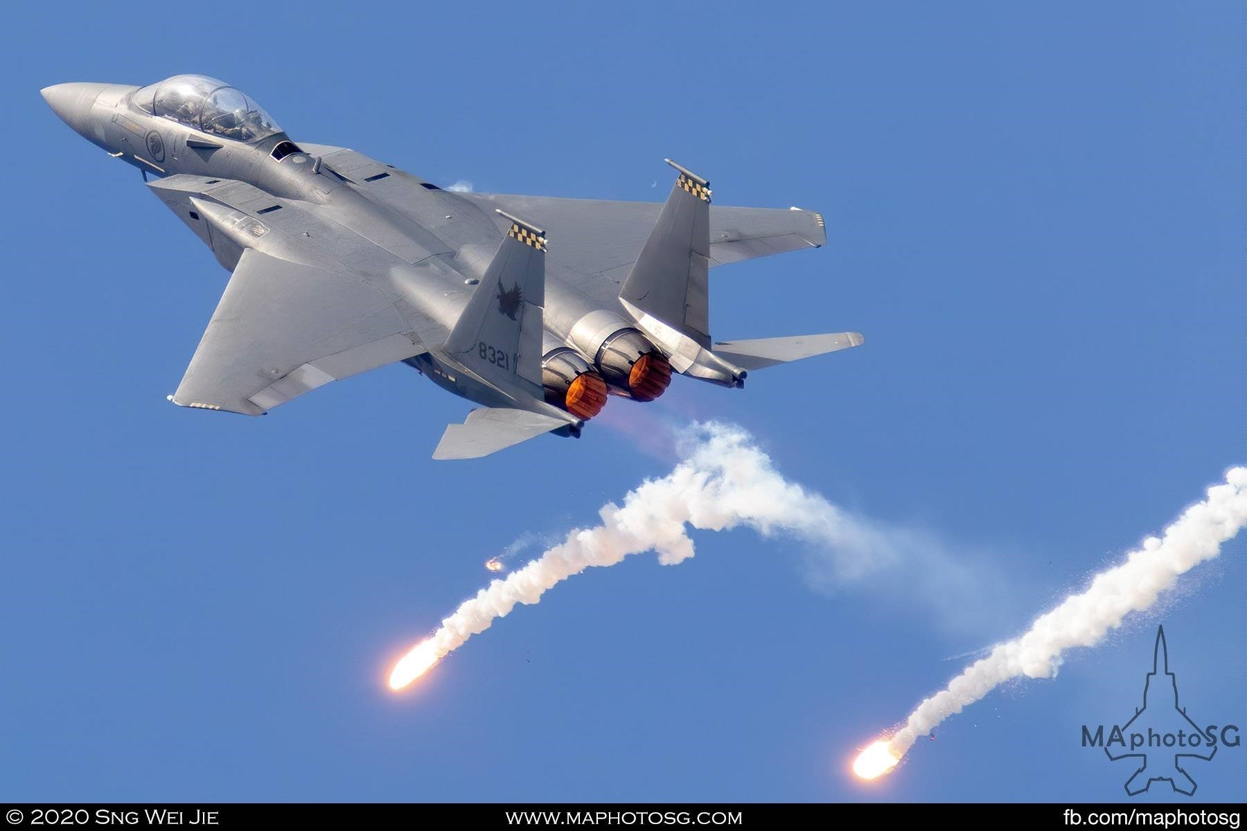 RSAF F-15SG releasing flares as it performs the wheel of fire