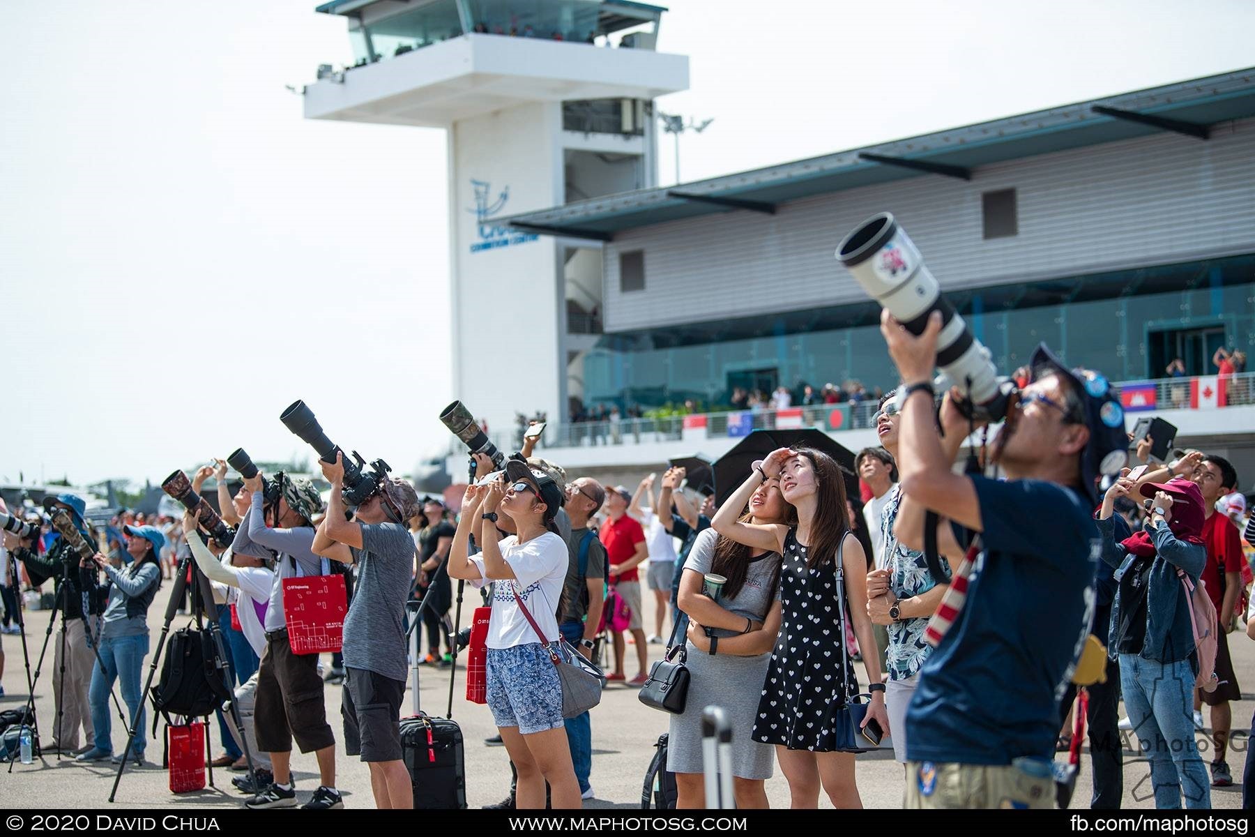 Cameras of all shapes and sizes point upwards as the aerial display teams put out their best performances