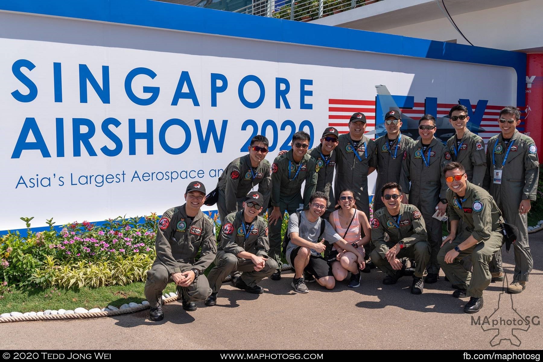 RSAF Aerial Display Team posing with a couple for a group photo