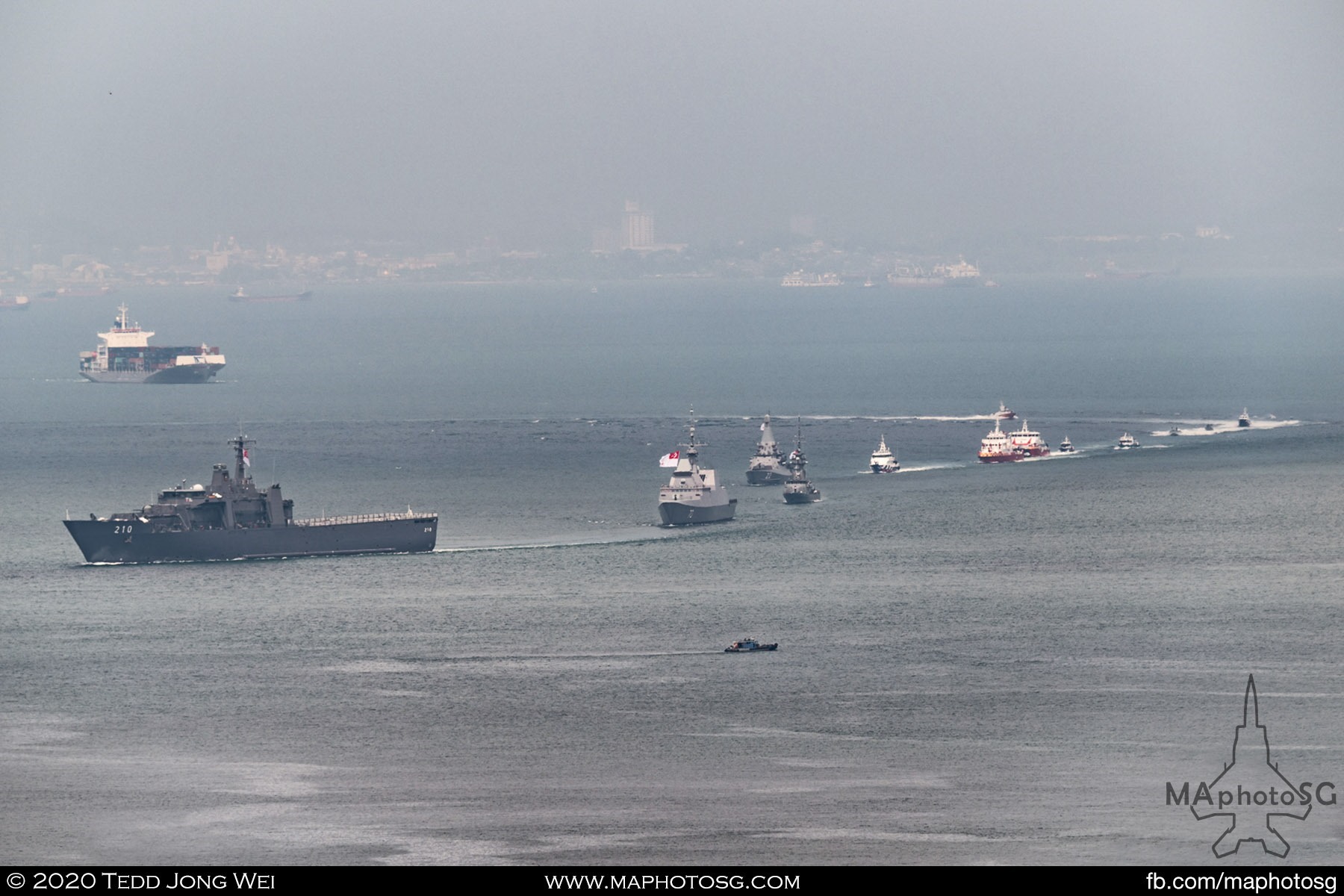 The RSN Endurance-class Landing Ship Tank, RSS Endeavour, leads the entire Maritime Sailpast fleet off the Marina South coast.