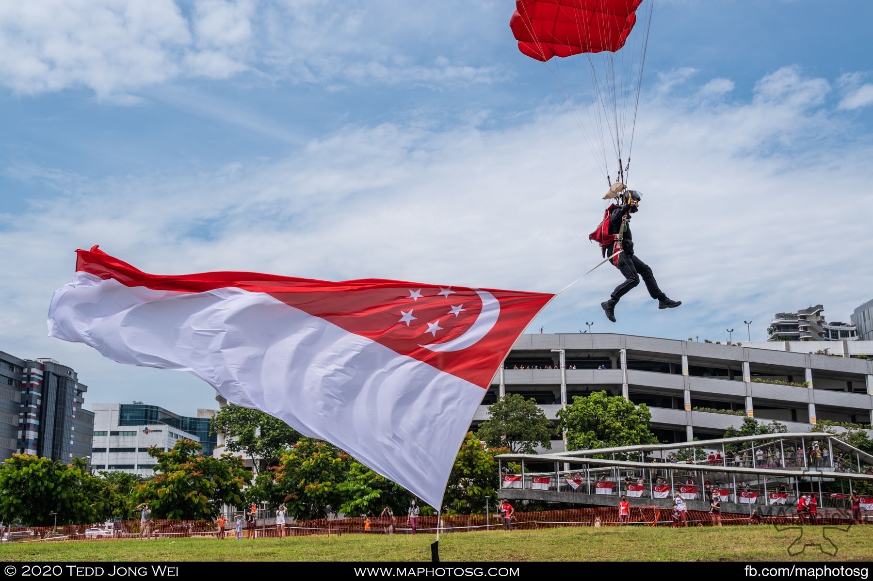 A Red Lion with the State Flag comes in for a landing after their freefall descent.