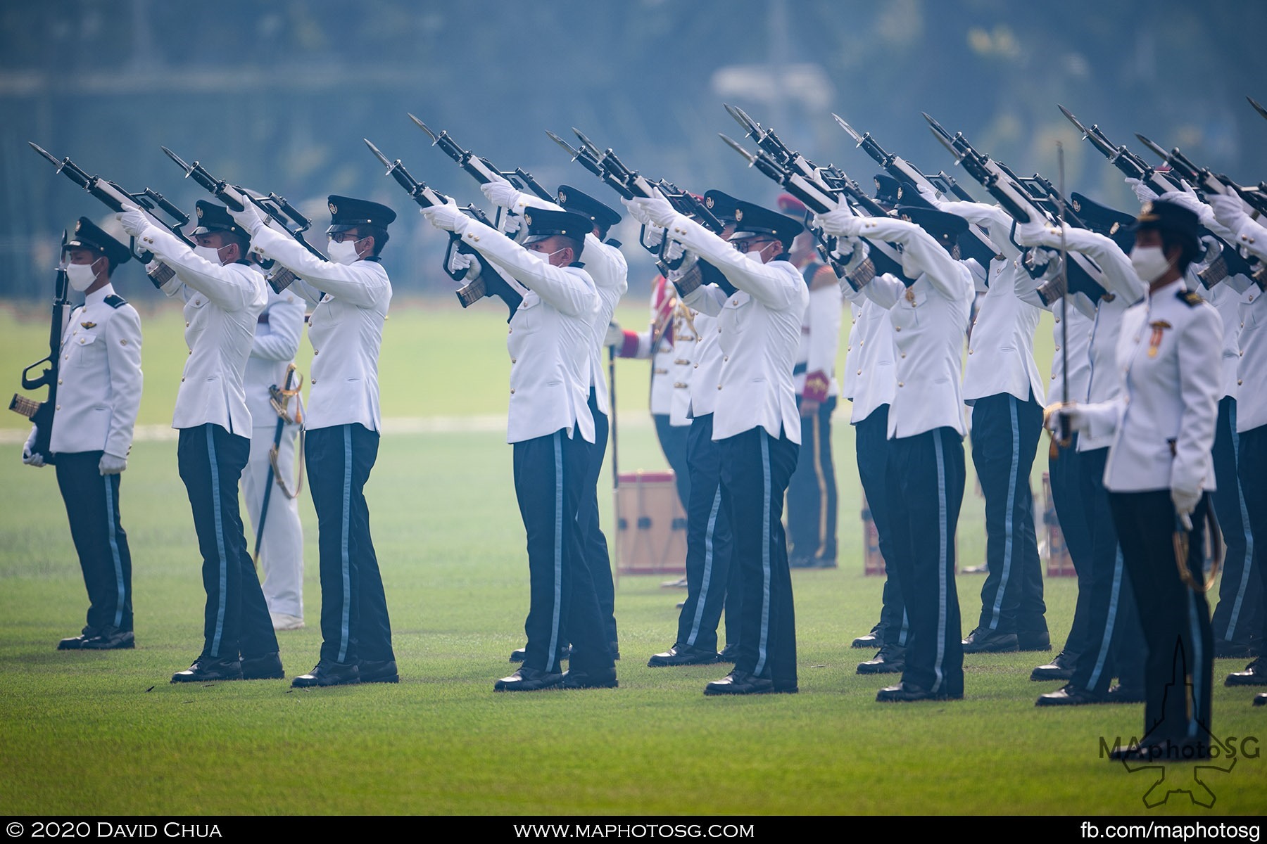 The Air Force Guard of Honour contingent fires off a round during the Feu de Joie (Fire of Joy) at the Parade@Padang.