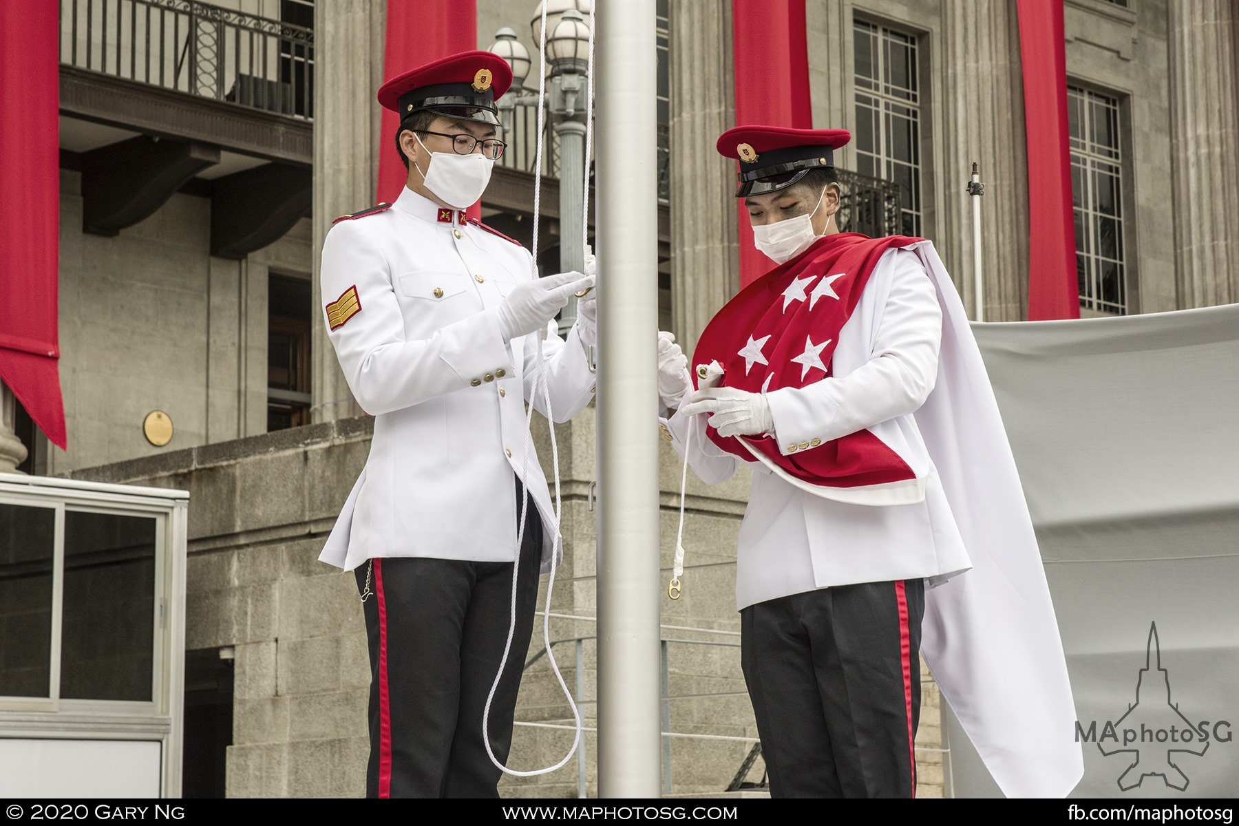 The State Flag is prepared for hoisting during a parade rehearsal.