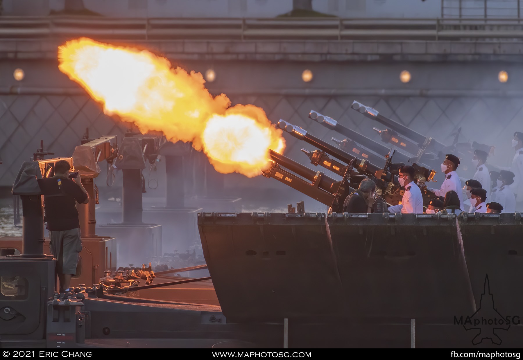 Firing a shot for the 21 gun salute