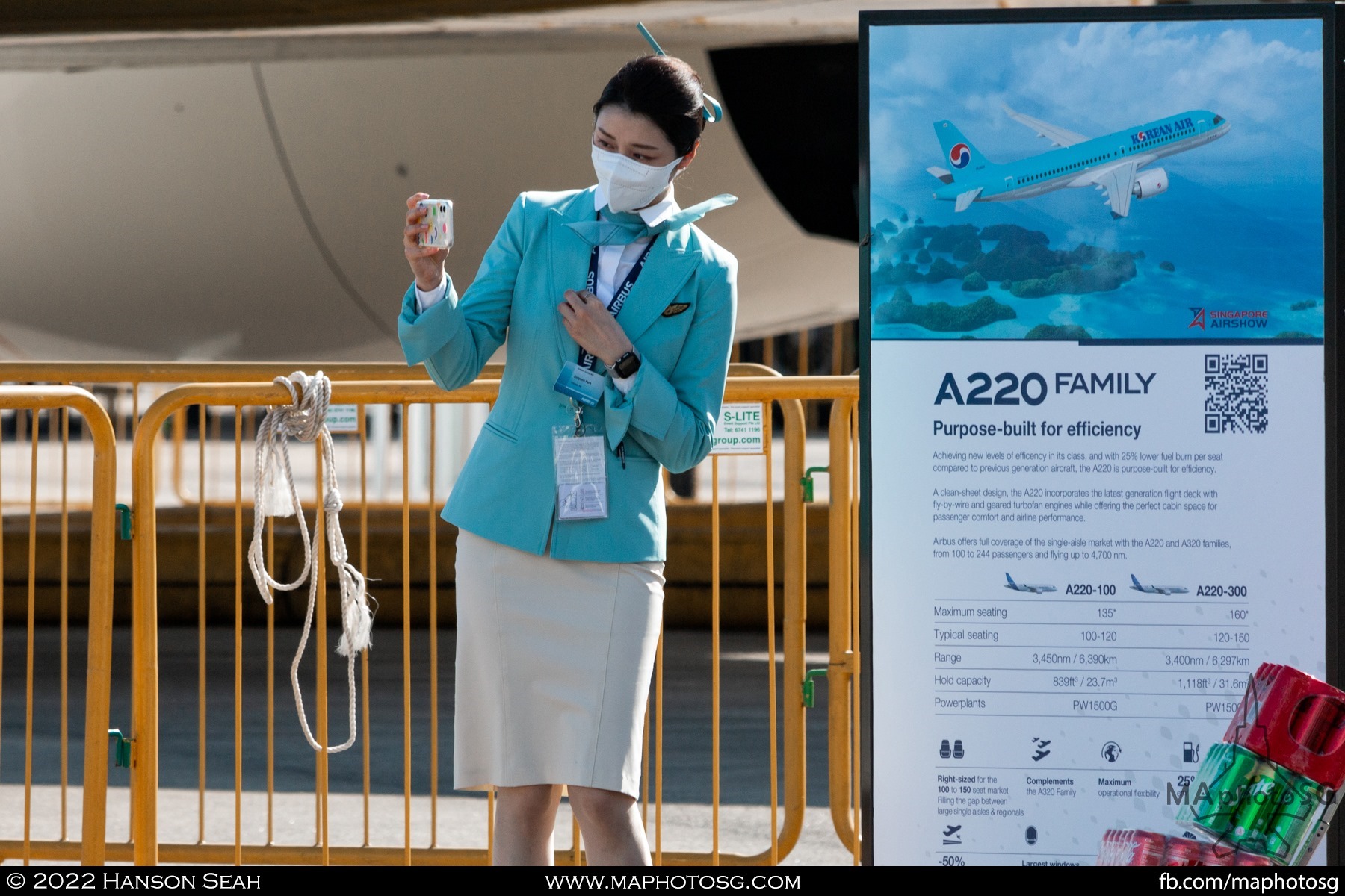 Korean Air stewardess taking a selfie at the static display their aircraft