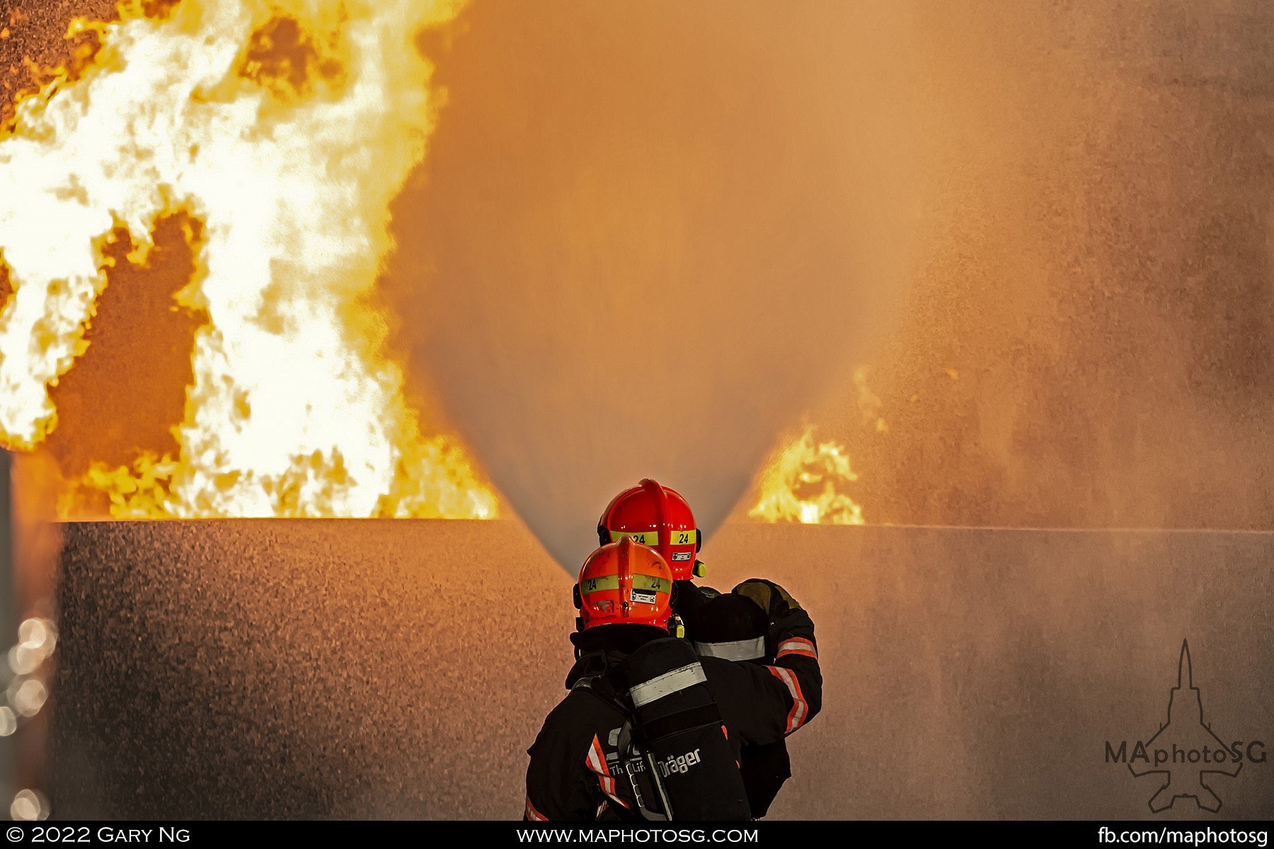 Firemen from the SCDF puts out a simulated fire