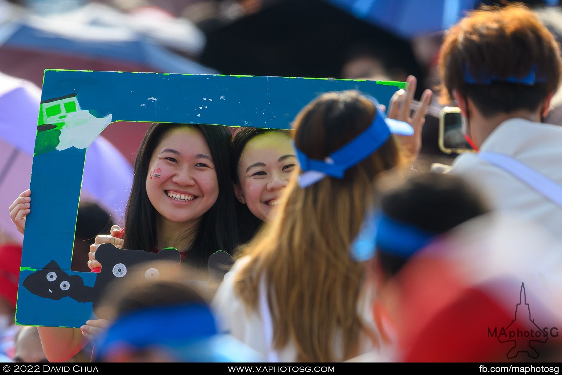 Spectators taking a social media moment