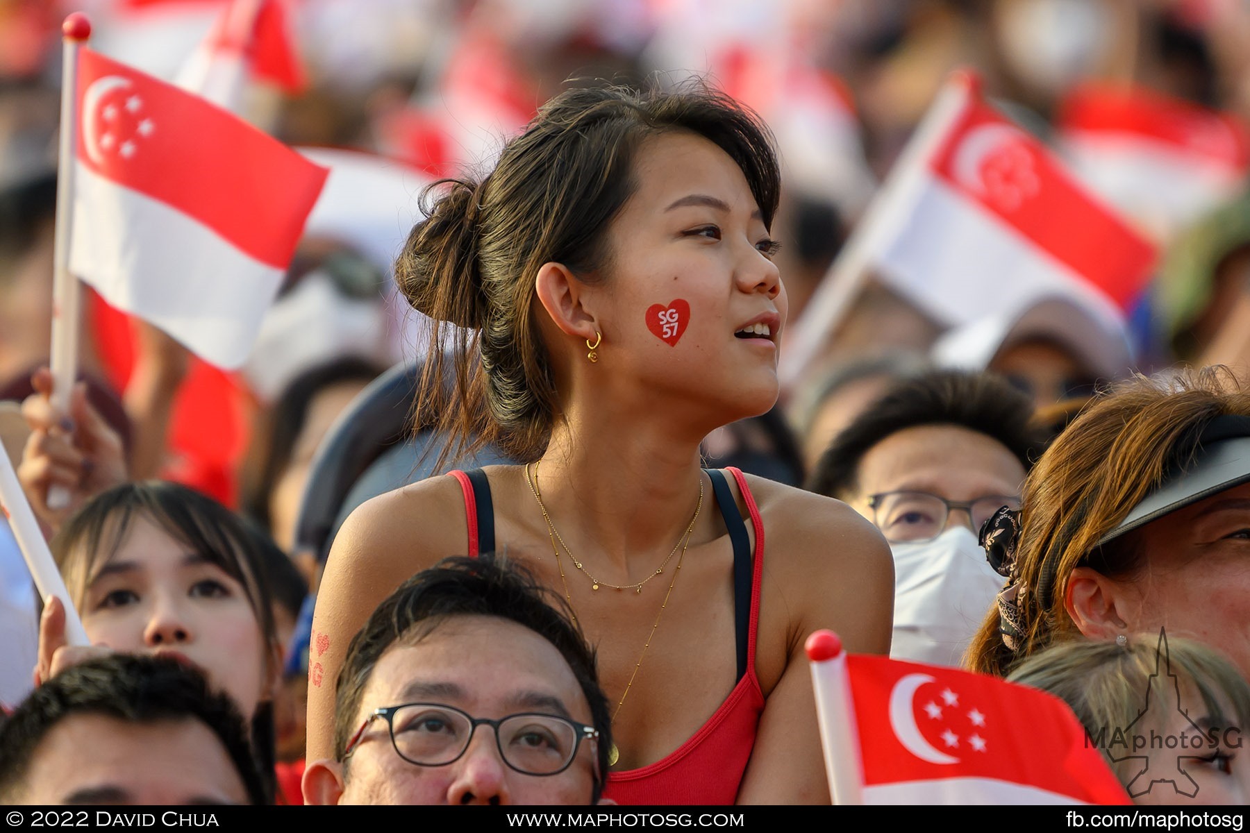 Looking on as President Halimah Yacob arrives