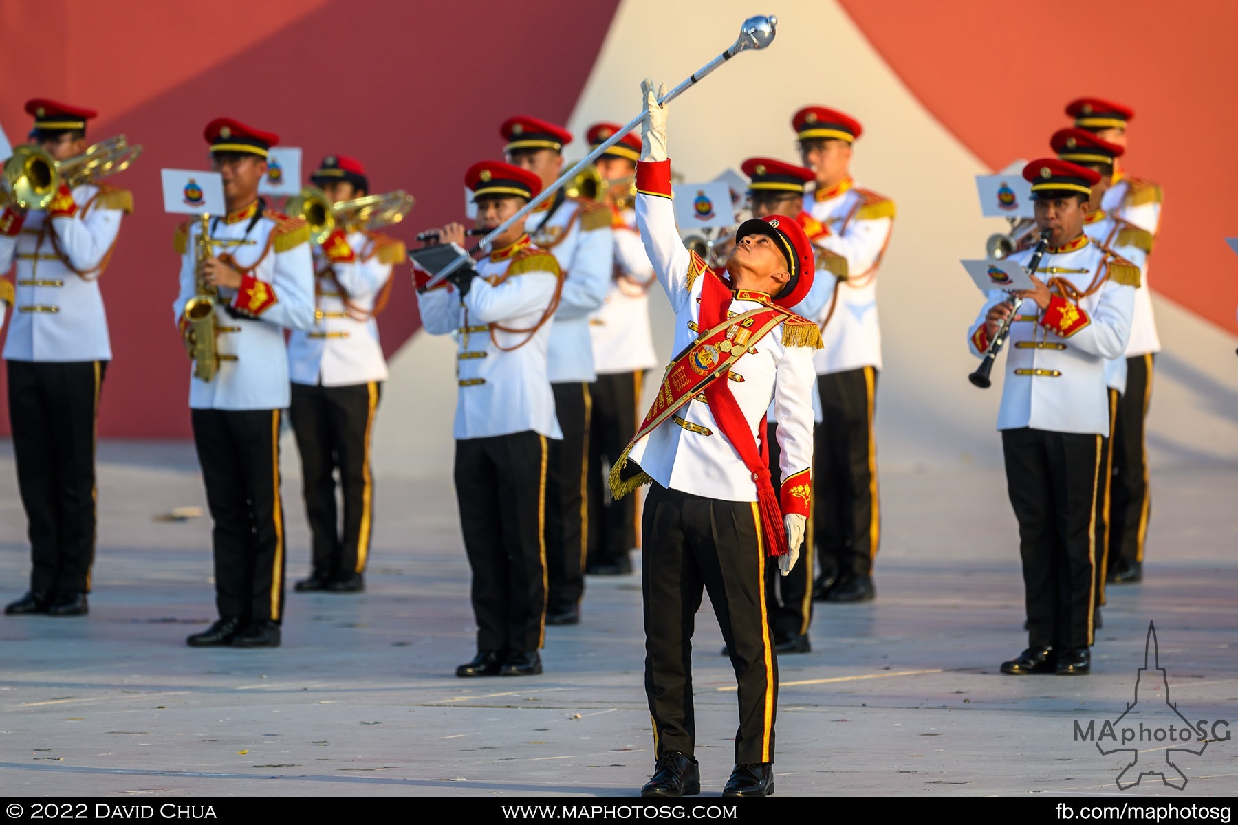 SAF Band drum major catches the drum major mace after he threw it up the air