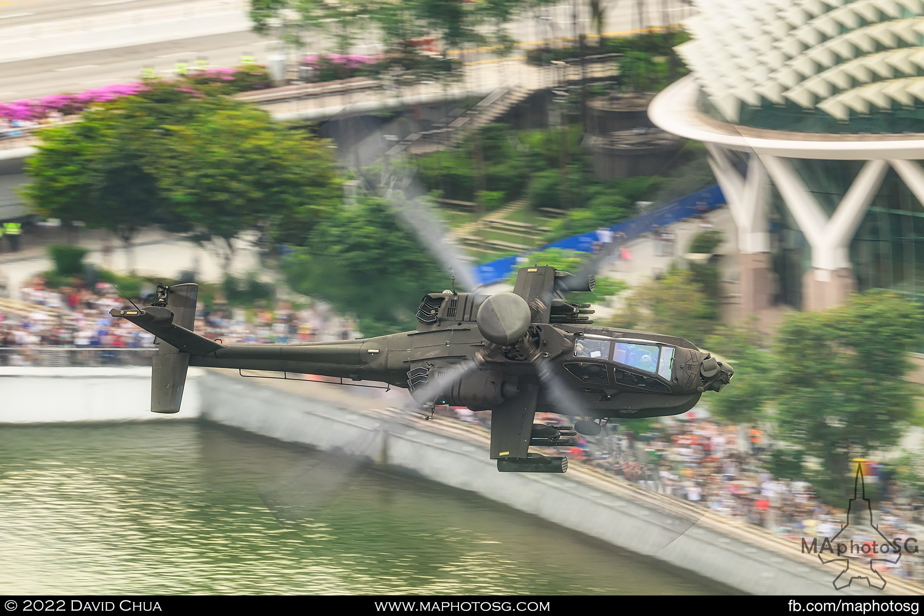 Apache flies past the Esplanade Waterfront as it reenters show centre